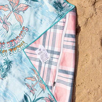 Sand-free beach towel with zip corner pocket